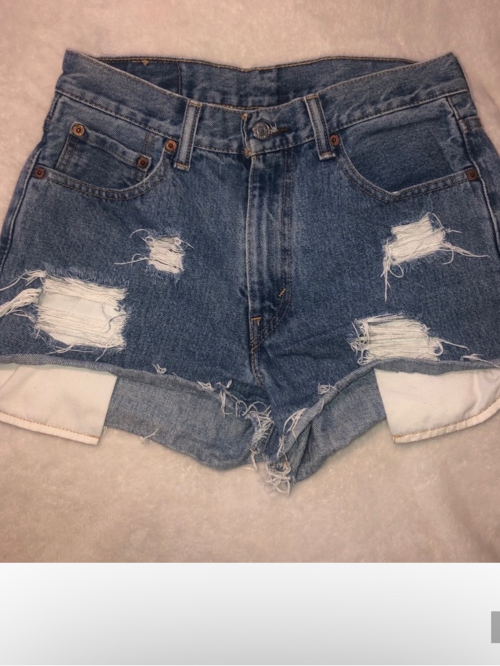 Levi's Distressed Denim Shorts in Medium Blue